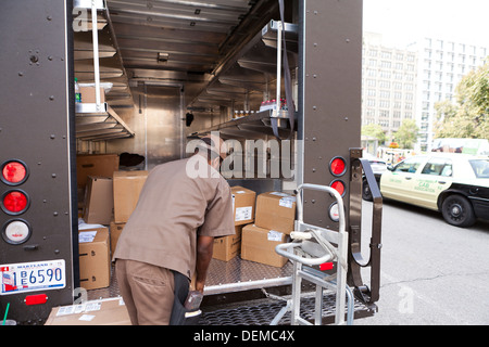 UPS man unloading truck - Washington, DC USA Stock Photo