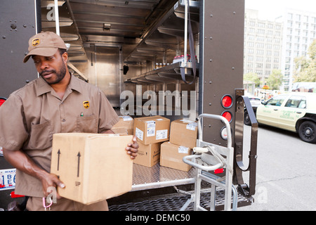 UPS man unloading truck - Washington, DC USA Stock Photo