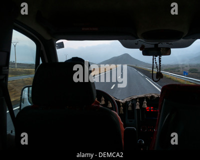 View of the Moroccan countryside from inside a car during a road trip in Morocco Stock Photo
