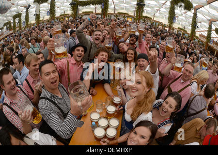 Munich, Germany. 21st Sep, 2013. Guests celebrate at the Hofbraeu-beer tent at the Oktoberfest in Munich, Germany, 21 September 2013. The Oktoberfest is held between 21 September and 06 October 2013. Photo: FELIX HOERHAGER/dpa/Alamy Live News Stock Photo