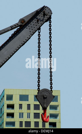 Construction crane in front of a building Stock Photo