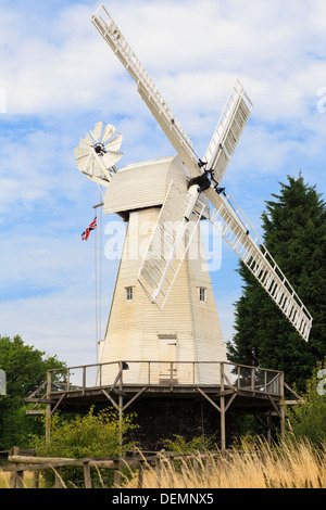 19th century Kentish smock mill restored and working white wooden windmill in Woodchurch, Kent, England, UK, Britain Stock Photo