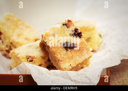 small traditional german christmas stollen pieces on parchment paper Stock Photo