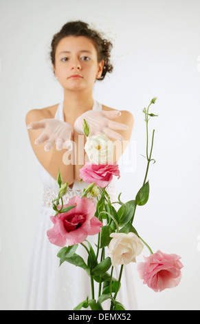 Close-up of flowers and a bride behind Stock Photo