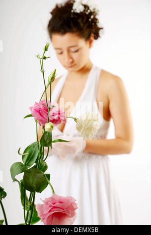 Close-up of flowers and a bride behind Stock Photo