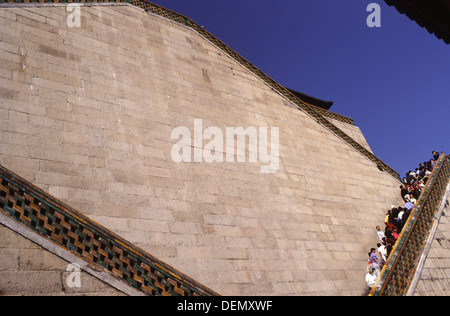 Visitors line the steep steps of the Buddhist Virtue Temple at the Summer Palace in Beijing China Stock Photo