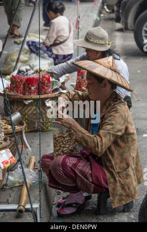 A street seller in the town of  Mae Sai near the Myanmar border, Thailand Stock Photo