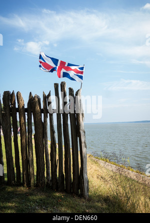 The Union Jack flag flies over the Jamestown Settlement and the statue of Captain John Smith in Virginia. Stock Photo