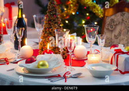 Preparing for Christmas Eve at beautifully decorated table Stock Photo