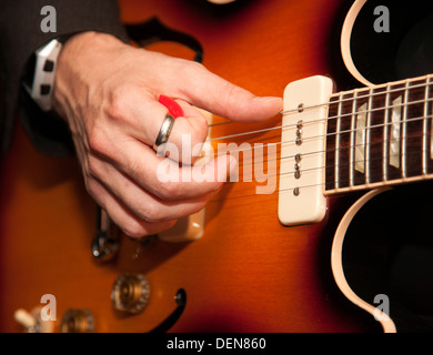 Close up electric guitar being played Stock Photo