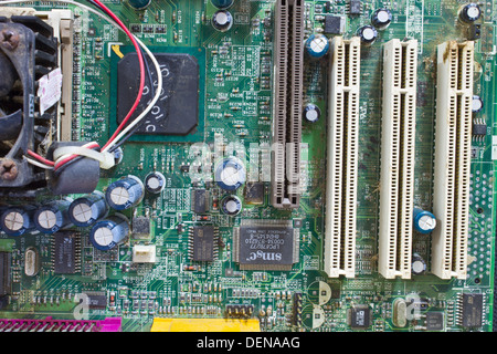 Detail circuit, detail dusty old computer mainboard Stock Photo
