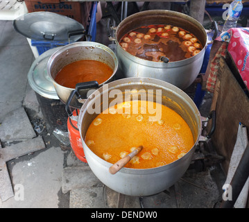 Thai curries cooking at street market, Bangkok, Thailand Stock Photo