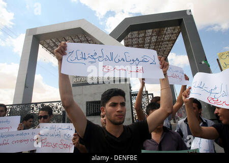 Sept. 22, 2013 - Rafah, Gaza Strip - Palestinian students who are studying at Egyptian universities during a protest demanding the opening of the Rafah border crossing. Egypt closed the Rafah terminal on Friday after it was opened for two days for students and urgent supplies. (Credit Image: © Eyad Al Baba/APA Images/ZUMAPRESS.com) Stock Photo