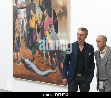 Painter Neo Rauch (L) and gallery owner Gerd Harry Lybke stand next to Rauch's painting 'Speertanz' at gallery Eigen + Art' in Leipzig, Germany, 21 September 2013. The gallery presents Rauch's new works as part of the tour of Spinnerei galleries. Photo: Hendrik Schmidt Stock Photo