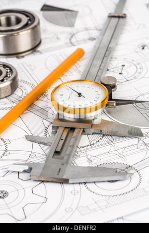 Metal vernier caliper on technical drawing Stock Photo