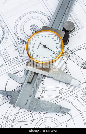 Metal vernier caliper on technical drawing Stock Photo