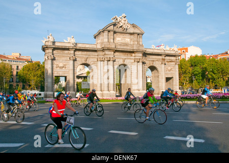 People riding bike in the Bike Party. Alcala Gate, Madrid, Spain. Stock Photo