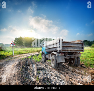 Truck on a country road in field Stock Photo