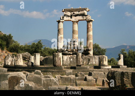 Three columns still standing in the sanctuary of Athena Pronaia in Delphi, Greece. Stock Photo