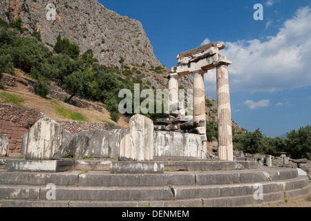 Three standing doric columns in the Sanctuary of Athena Pronaia in Delphi, Greece. Stock Photo