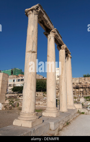 Row of four ionic columns made of gray Hymettian marble in the Roman Agora of Athens, Greece. Stock Photo