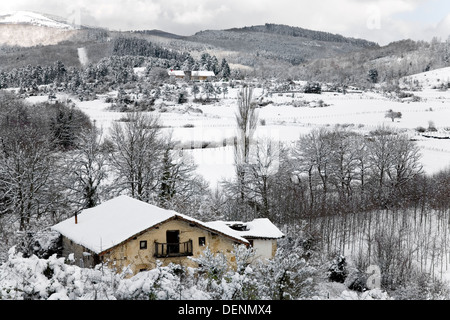 Snow covered landscape in winter.  Zuia, Alava, Basque Country, Spain, Europe. Stock Photo