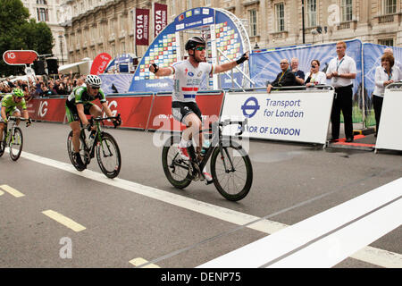 London, UK. 22nd Sep, 2013. Mark Cavendish riding for Omega Pharma Quick-Step celebrates becoming Stage 8 Winner of the 2013 Tour of Britain, as he approaches the finish line in first position Photo by Sue Bowdery Credit:  Sue Bowdery/Alamy Live News Stock Photo