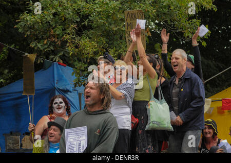 Balcombe, West Sussex, UK. 22nd Sep, 2013. Joyful environmentalists cheer Simon Welsh at 'Belt it out at Balcombe 3' event outside the Cuadrilla site.   The anti fracking environmentalists are protesting against test drilling by Cuadrilla on the site in West Sussex that could lead to the controversial fracking process. Credit:  David Burr/Alamy Live News Stock Photo
