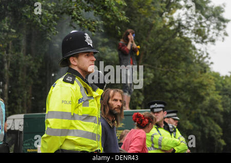 Balcombe, West Sussex, UK. 22nd Sep, 2013. Friendly atmosphere between Police and environmental protesters at 'Belt it out at Balcombe 3' event outside the Cuadrilla site.   The anti fracking environmentalists are protesting against test drilling by Cuadrilla on the site in West Sussex that could lead to the controversial fracking process. Credit:  David Burr/Alamy Live News Stock Photo