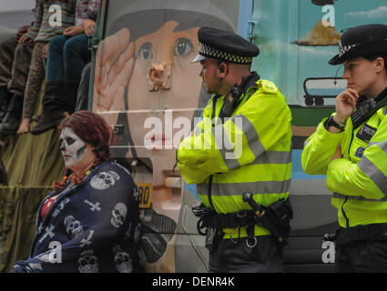 Balcombe, West Sussex, UK. 22nd Sep, 2013. Friendly atmosphere as Police look on at 'Belt it out at Balcombe 3' event outside the Cuadrilla site.The anti fracking environmentalists are protesting against test drilling by Cuadrilla on the site in West Sussex that could lead to the controversial fracking process. Credit:  David Burr/Alamy Live News Stock Photo