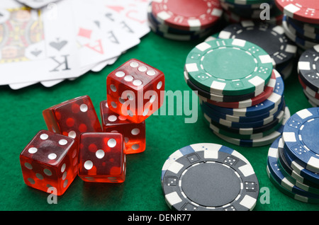 dices, cards and casino chips on a green baize Stock Photo