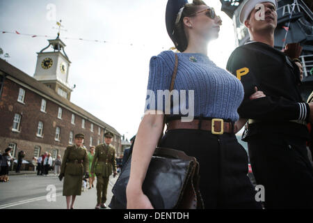 Chatham, UK. 21st Sep, 2013. Salute to the 40's - Britain's 1940's Home Front Event at The Historic Dockyard Chatham. Parade of vintage fashion for those in 1940's attire. Credit:  Tony Farrugia/Alamy Live News Stock Photo