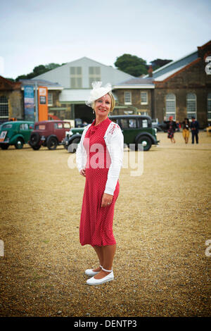 Chatham, UK. 21st Sep, 2013. Salute to the 40's - Britain's 1940's Home Front Event at The Historic Dockyard Chatham.  1940's female fashion and vintage cars. Credit:  Tony Farrugia/Alamy Live News Stock Photo