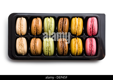 colorful macaroons in plastick box on white background Stock Photo