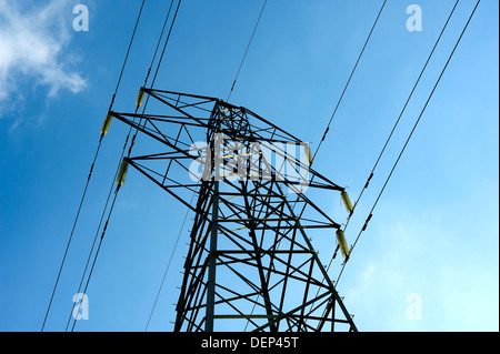 ELECTRICAL POWER PYLON WITH SUPPLY CABLES OR LINES AGAINST A BLUE SKY ELECTRIC Stock Photo