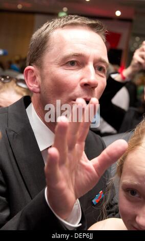 Berlin, Germany. 22nd Sep, 2013. Bernd Lucke, the top candidate for the party Alternative for Germany (AfD), cheers to the first results of the 2013 German federal elections in Berlin, Germany, 22 September 2013. Photo: JOERG CARSTENSEN/dpa/Alamy Live News Stock Photo