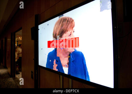 Berlin, Germany. 22nd Sep, 2013. A TV screen shows a picture with an interference of German Chancellor Angela Merkel at the election party of the party Alternative for Germany (AfD) in Berlin, Germany, 22 September 2013. Photo: JOCHEN LUEBKE/dpa/Ģ����ý Live News Stock Photo
