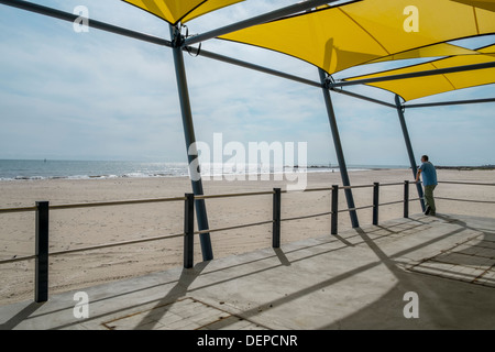 Lifeguards watch out from a surf life saving tower on an Australian beach in Glenelg, Adelaide. Stock Photo