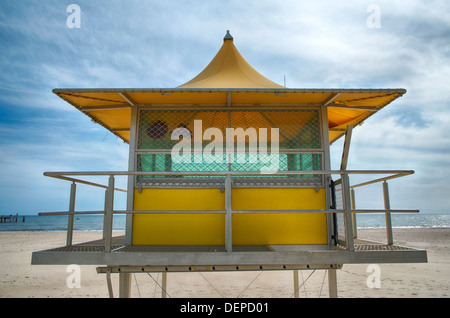 Lifeguards watch out from a surf life saving tower on an Australian beach in Glenelg, Adelaide. Stock Photo