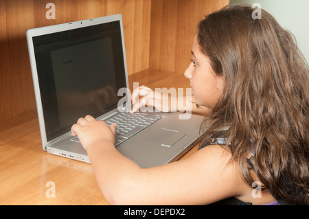 Girl using laptop Stock Photo
