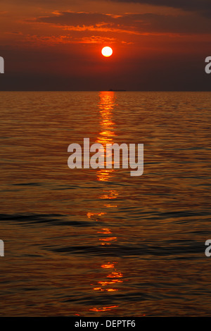 beautiful vibrant sunset over the sea, vertical shot Stock Photo
