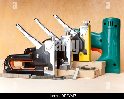 The tool - staplers electrical and manual mechanical - for repair work in the house and on furniture, and brackets Stock Photo