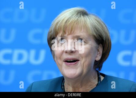 Berlin, Germany. 23rd Sep, 2013. German Chancellor and CDU chairwoman Angela Merkel laughs at the CDU press conference after the 2013 German federal elections in Berlin, Germany, 23 September 2013. Photo: MARCUS BRANDT/Dpa/Alamy Live News Stock Photo