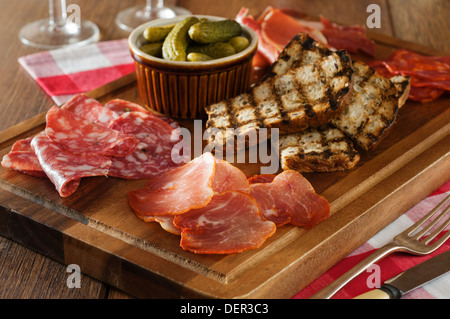 Charcuterie board. Cold meats sharing platter. Stock Photo