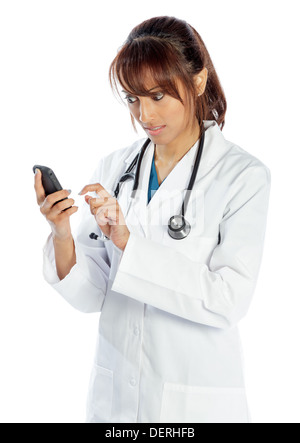 Attractive Indian doctor woman posing in a studio in front of a background Stock Photo