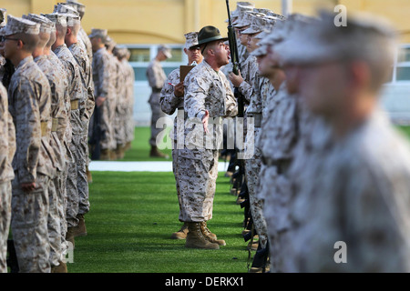 US Marine Staff Sgt. Christian Fuentes motivates recruits as he moves down the rows during the senior drill instructor inspection at Marine Corps Recruit Depot San Diego August 23, 2013 in San Diego, CA. Stock Photo