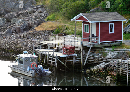 Small, modern fishing shack and boat in Quidi Vidi, Newfoundland Stock Photo