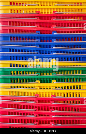 Colorful plastic shopping baskets stacked, Oregon Stock Photo