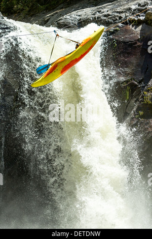 KAYAK SUSPENDED ON A ZIP LINE ZIPLINE EXTREME SPORT THEME Stock Photo