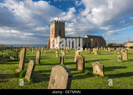 St. Aidan's Church in the village of Bamburgh, Northumberland, England Stock Photo